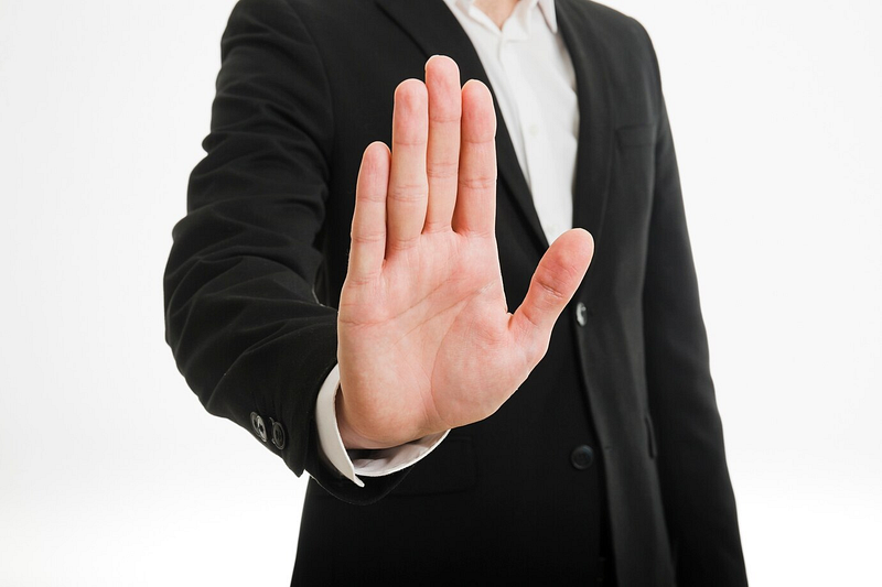 Hand stop sign — bookmaker stake limits and account restrictions